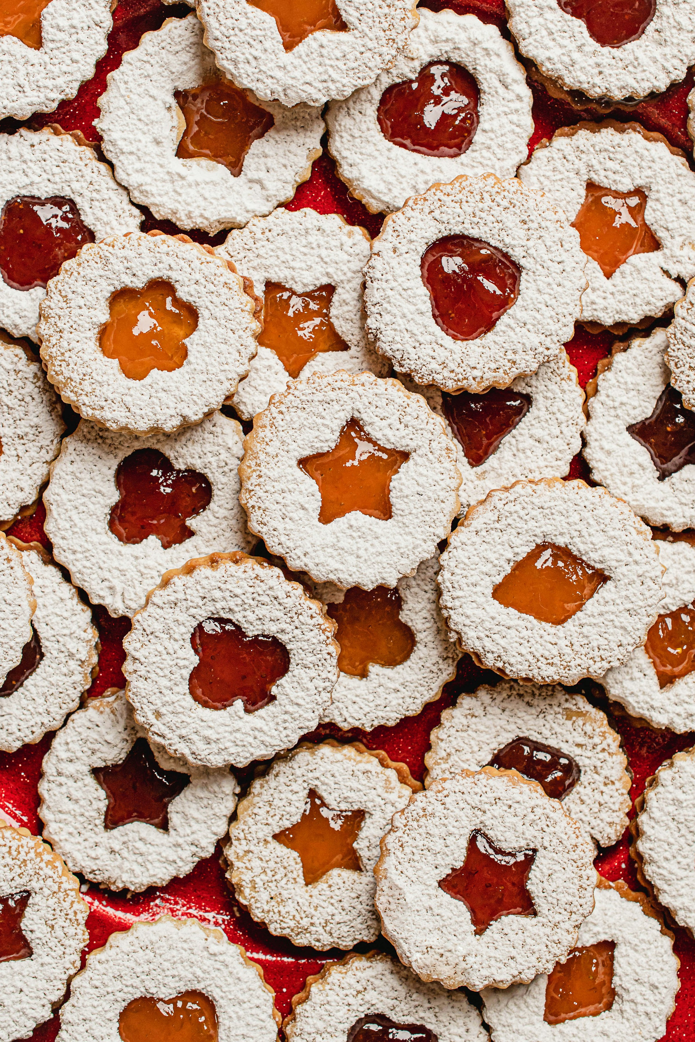 Dozens of small Austrian pastries dusted with powdered sugar, arranged for a gift